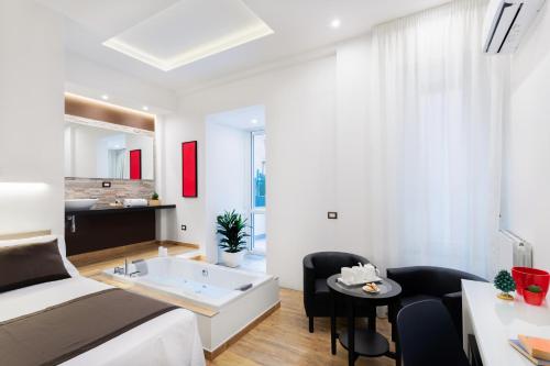 Lighea aqua suites and breakfast客房内的一张或多张床位