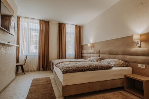 Villa Martini - apartments & rooms客房内的一张或多张床位