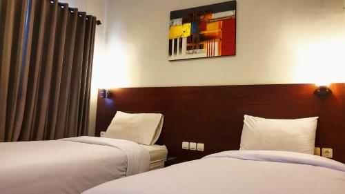 塔拉巴厘岛住宅公寓客房内的一张或多张床位
