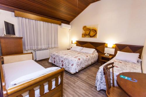 Tri Hotel Lago Gramado客房内的一张或多张床位