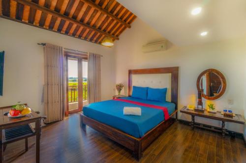 Calm House Hotel Hoi An 1客房内的一张或多张床位