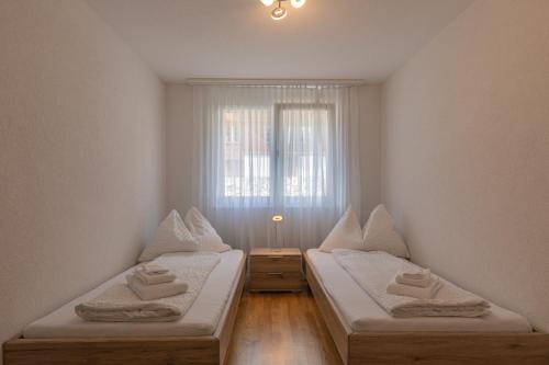 Chalet Gousweid- Mönch Apartment客房内的一张或多张床位