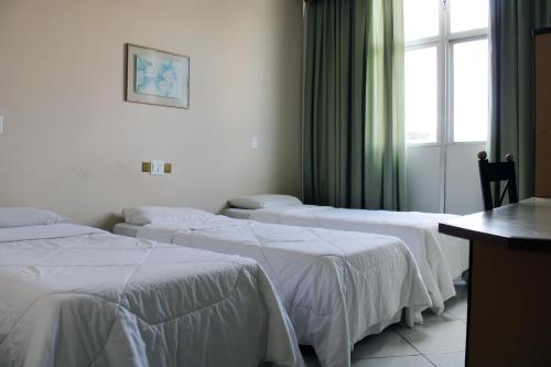 Realminas Hotel e Restaurante客房内的一张或多张床位