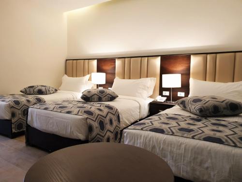 Petra Heart Hotel客房内的一张或多张床位