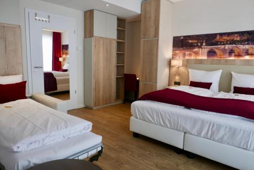 Rafaela Hotel Heidelberg客房内的一张或多张床位