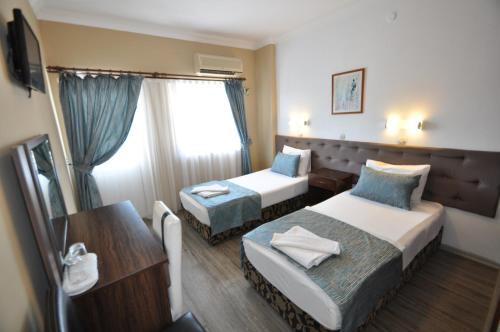 Reis Maris Hotel客房内的一张或多张床位