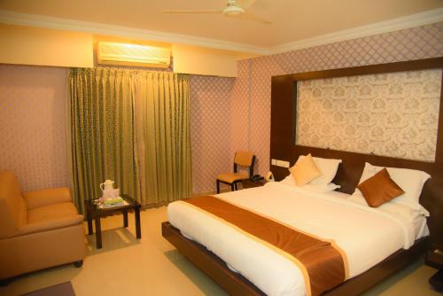 Grand Maurya Hotel And Resort客房内的一张或多张床位