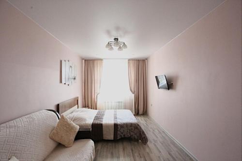 Апартаменты на Байкальской客房内的一张或多张床位