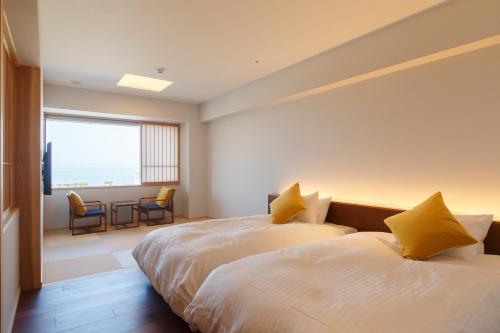 Iseya, Seaview Private Onsen Bath客房内的一张或多张床位