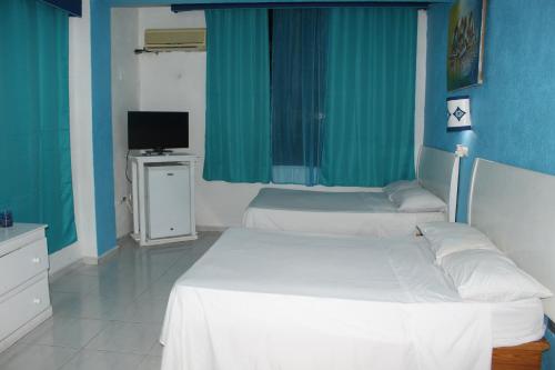 Aparta Hotel Azzurra客房内的一张或多张床位