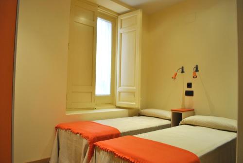 拉朱德里亚住宿酒店客房内的一张或多张床位