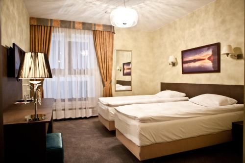 莫德林机场索克沃弗斯卡酒店客房内的一张或多张床位
