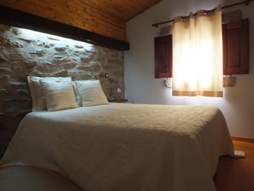 巴洛奥尔卡萨尔旅游度假村客房内的一张或多张床位