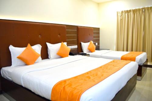 Saibala Grand Airport Hotel客房内的一张或多张床位