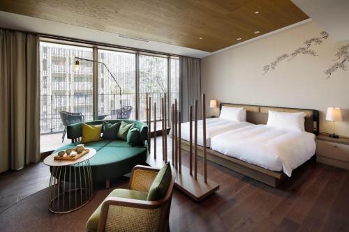 GOOD NATURE HOTEL KYOTO客房内的一张或多张床位