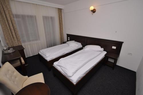 塞布尔酒店客房内的一张或多张床位