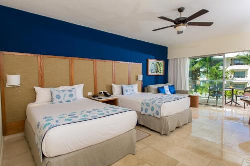 Impressive Premium Punta Cana - All Inclusive客房内的一张或多张床位