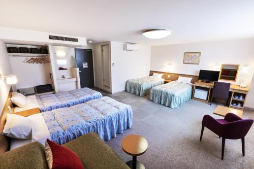 利尻海岛宾馆客房内的一张或多张床位