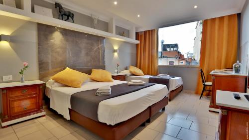 Hotel Giolitti Smart客房内的一张或多张床位