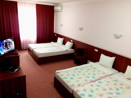 Hotel Oxa doo客房内的一张或多张床位