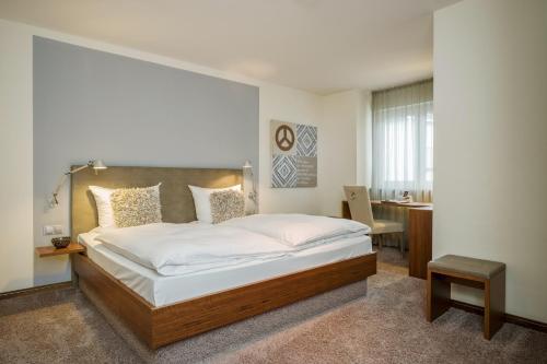爱姆黑沃特斯图穆酒店客房内的一张或多张床位