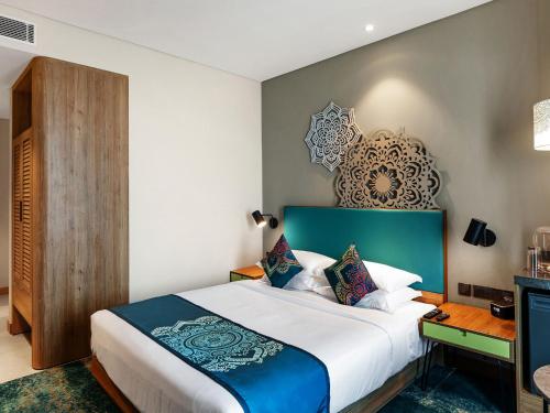 Grand Mercure Ahmedabad GIFT City - An Accor Hotels Brand客房内的一张或多张床位