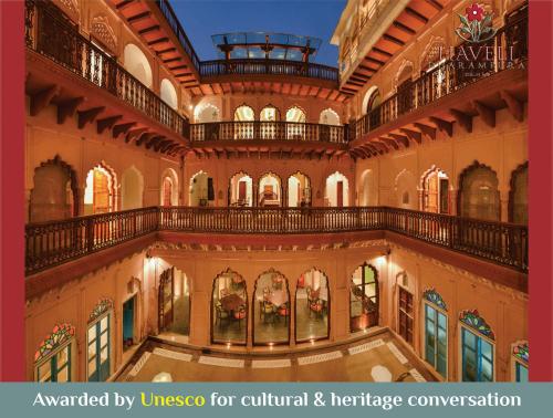 新德里Haveli Dharampura - UNESCO awarded Boutique Heritage Hotel的一座建筑物的形象,上面有古罗马文化与遗产的名词