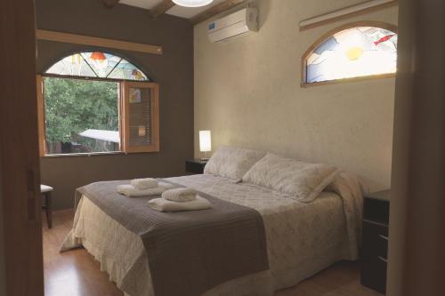 Apart Hotel La Bodega客房内的一张或多张床位