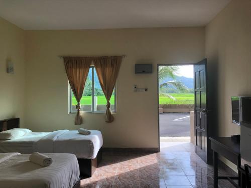 DVilla Guesthouse Langkawi客房内的一张或多张床位