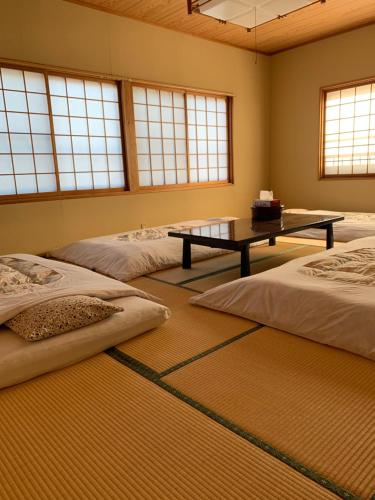 たから温泉民宿 Gem Onsen Stay客房内的一张或多张床位
