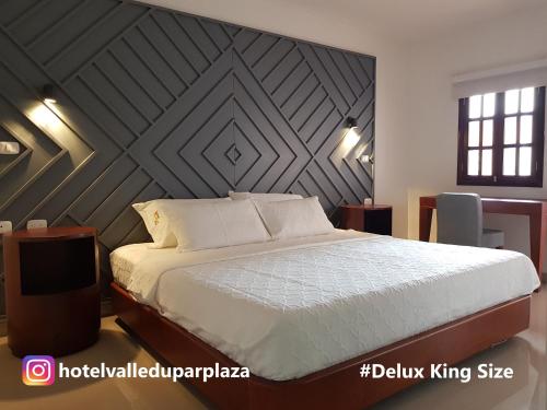 Hotel Valledupar Plaza客房内的一张或多张床位