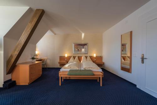 Parkhotel Gunten – Beach & Spa客房内的一张或多张床位
