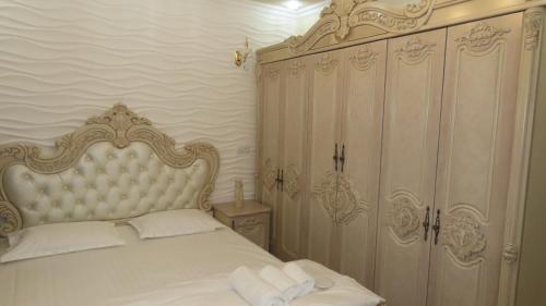 Primestay Samarkand Residences客房内的一张或多张床位