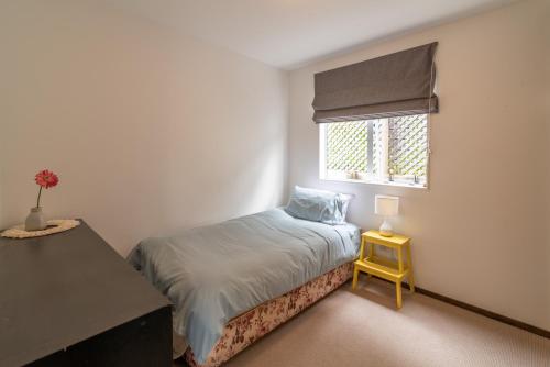 La Petite Maison - Akaroa Holiday Home客房内的一张或多张床位