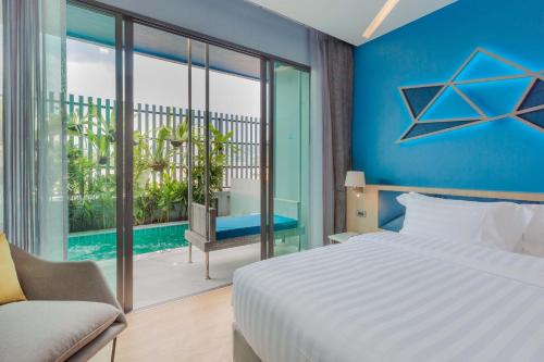 BlueSotel SMART Krabi Aonang Beach - Adults only - SHA Extra Plus客房内的一张或多张床位