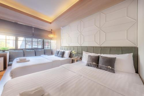 Tori Prestige Bangkok Hotel客房内的一张或多张床位