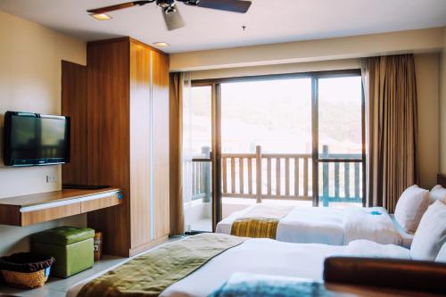 碧瑶阿德利亚公寓酒店客房内的一张或多张床位
