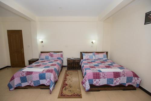 Honey Land Hotel Lalibela客房内的一张或多张床位