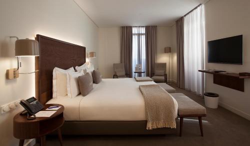 里斯本科尔坡圣托历史酒店客房内的一张或多张床位