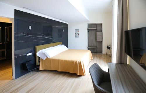 Municipio Luxury Suite客房内的一张或多张床位