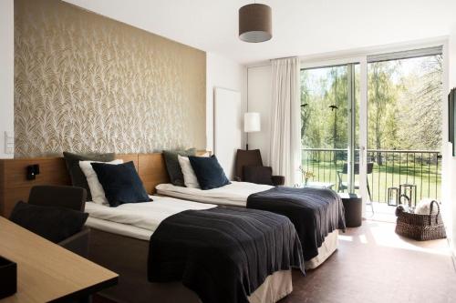 卢格思特加德酒店客房内的一张或多张床位