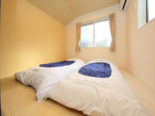 东京古都涩谷8公寓客房内的一张或多张床位