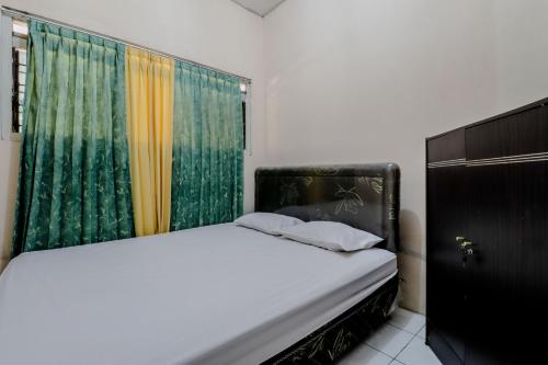 Omah Nggunung Cafe & Homestay客房内的一张或多张床位