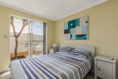 带免费WiFi的海洋之钥度假屋客房内的一张或多张床位