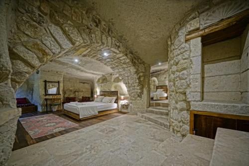 Naraca Cave House客房内的一张或多张床位