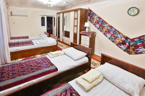Bukhara Star Guest House客房内的一张或多张床位