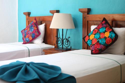 Hotel Casa Iguana Mismaloya客房内的一张或多张床位