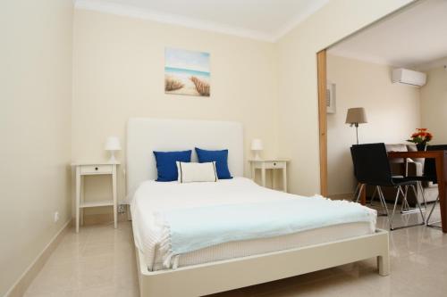 Apartamento Vila Arade客房内的一张或多张床位