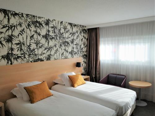 Hotel Inn Paris CDG Airport - ex Best Western客房内的一张或多张床位
