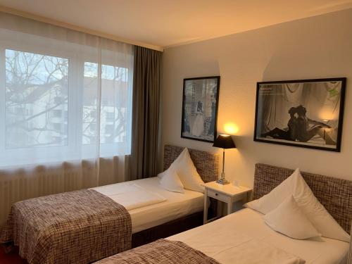 Hotel Nymphenburg City - München客房内的一张或多张床位